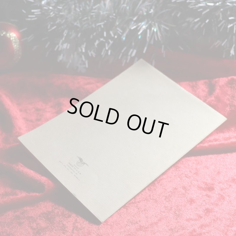 アンティーククリスマスカード|ポインセチアとクリスマスリースを抱える男女アンティークカード