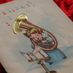 アンティーククリスマスカード紙もの｜管楽器スーザフォンでクリスマスキャロルを吹く天使1940年代