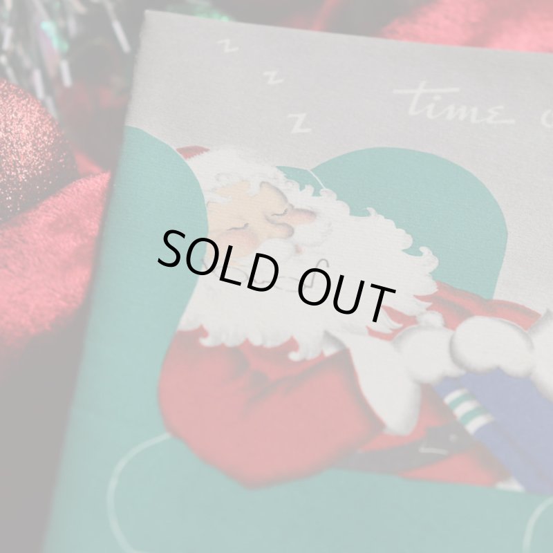 アンティーククリスマスカード紙もの｜ソファーで休憩するサンタクロース1940年代