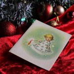 アンティーククリスマスカード紙もの｜キャンドルに灯りをつける天使1940年代