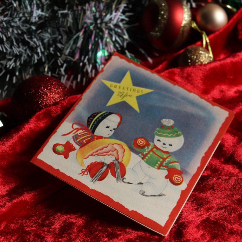 アンティーククリスマスカード紙もの｜スケートを楽しむ男の子と女の子のスノーマン1940年代